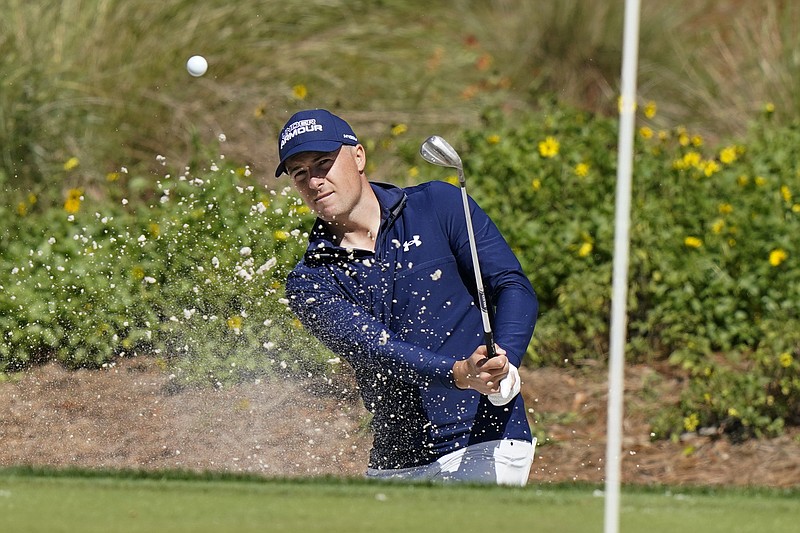 AP photo by Lynne Sladky / Jordan Spieth hits to the 14th green at TPC Sawgrass during the first round of The Players Championship on Saturday in Ponte Vedra Beach, Fla.