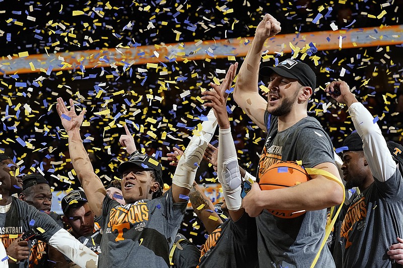 AP photo by Chris O'Meara / Tennessee guard Kennedy Chandler, left and forward Uros Plavsic celebrate after the Vols beat Texas A&M to win the SEC tournament title Sunday in Tampa, Fla.