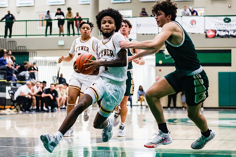 Staff photo by Troy Stolt / Tyner's Xavier Fisher (1) drives to the basket during the Best of Preps boys basketball tournament game between Tyner and Silverdale at East Hamilton high school on Monday, Dec. 27, 2021 in Ooltewah, Tenn.