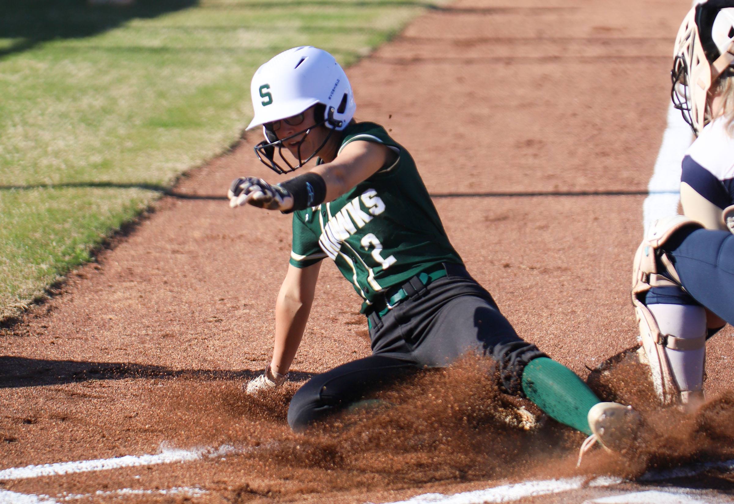 Staff photo by Olivia Ross / Silverdale's Addie Keef (2) slides into home. The Soddy Daisy Trojans took on the Silverdale Academy Seahawks on March 14, 2022 at home.