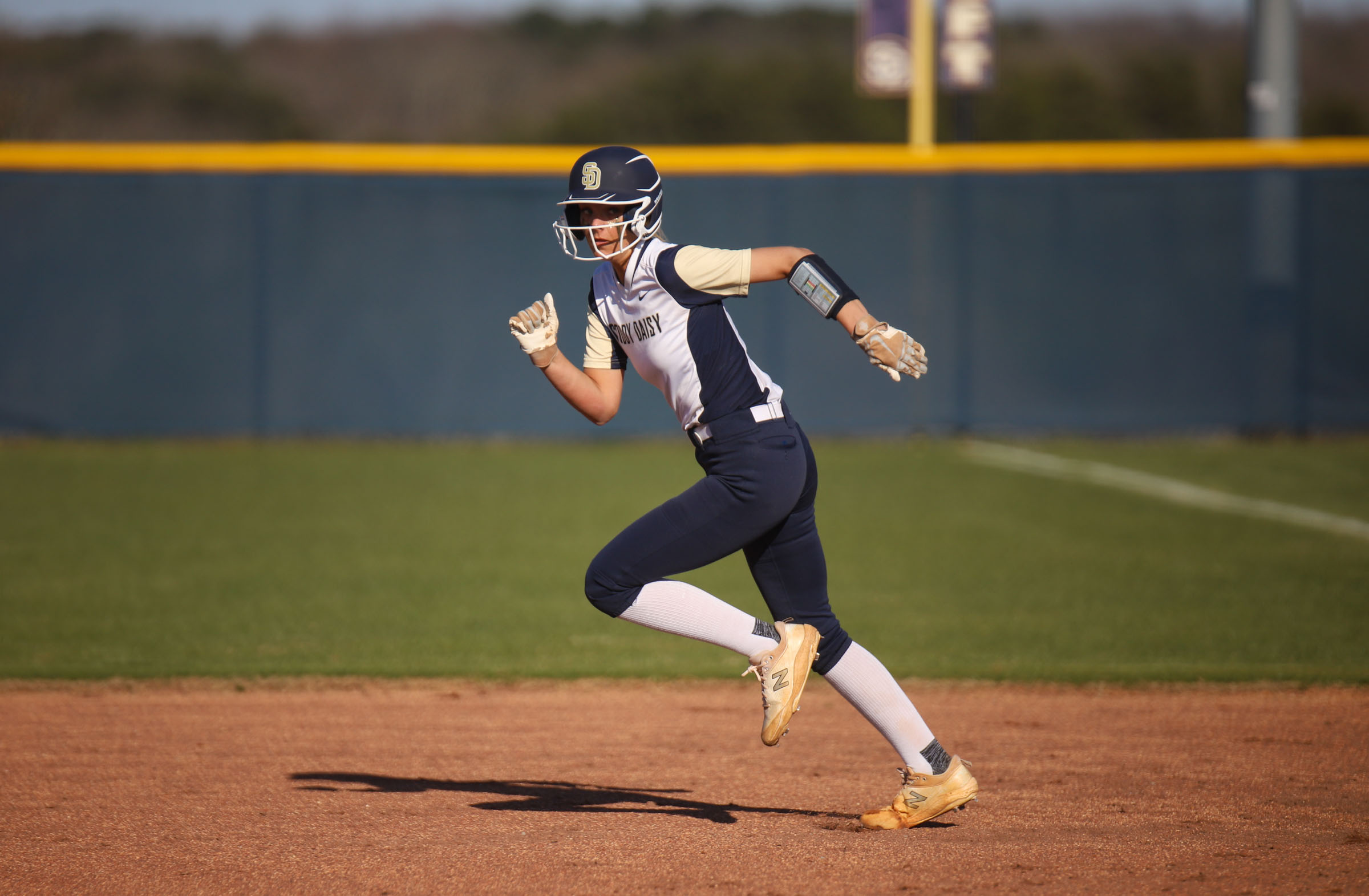 Staff photo by Olivia Ross / Soddy Daisy's Taylor Llyod (13) makes a run for 2nd. The Soddy Daisy Trojans took on the Silverdale Academy Seahawks on March 14, 2022 at home.