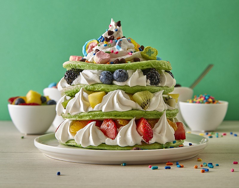 Photo Contributed by General Mills / Lucky Charms Cereal Pancakes are tinted green then stacked with dollops of whipped cream, chunks of fresh fruit and a sprinkling of marshmallows from a box of Lucky Charms cereal.