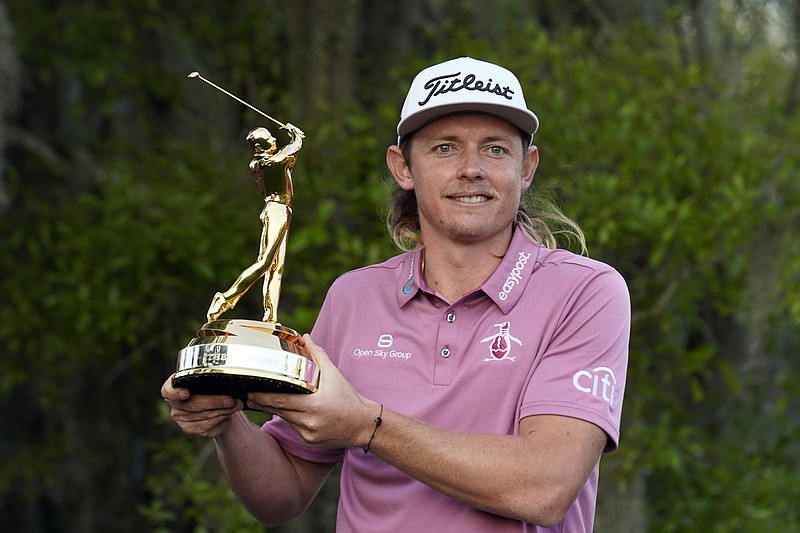 Cameron Smith, of Australia, holds the trophy after winning The Players Championship golf tournament Monday, March 14, 2022, in Ponte Vedra Beach, Fla. (AP Photo/Gerald Herbert)