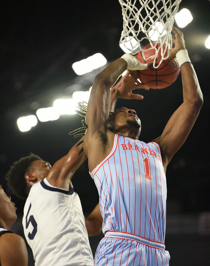 Staff Photo by Matt Hamilton / Power Center Academy (5) Cordarious Sledge defends as Brainerd (1) Donivon Thomas puts up a shot on Tuesday, March 15, 2022 in Murfreesboro during the opening round of the class 2A boys state basketball tournament at Murphy Center on the campus of Middle Tennessee State University.