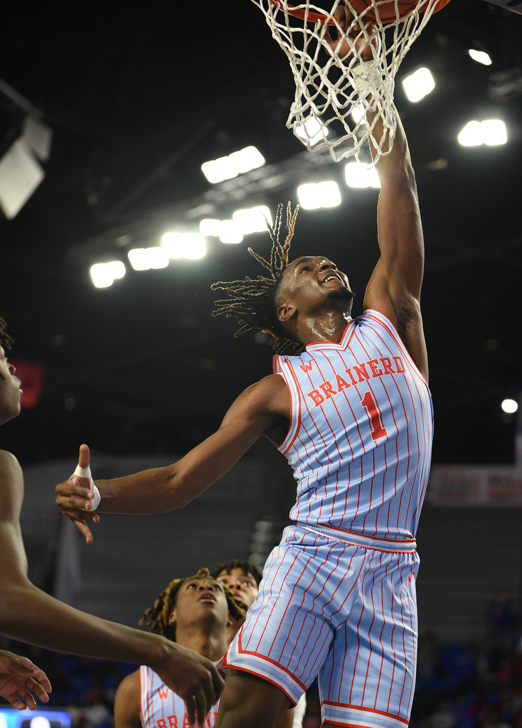 Staff Photo by Matt Hamilton / Brainerd (1) Donivon Thomas drives to the hoop on Tuesday, March 15, 2022 in Murfreesboro during the opening round of the class 2A boys state basketball tournament at Murphy Center on the campus of Middle Tennessee State University.