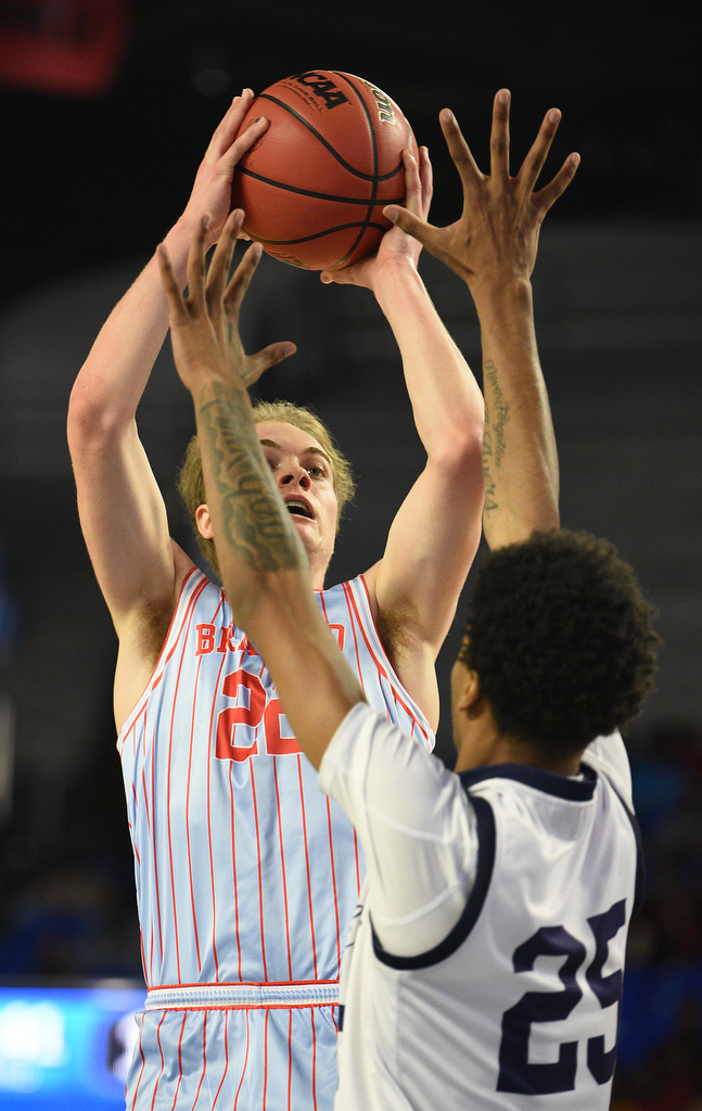 Staff Photo by Matt Hamilton / Power Center Academy (25) Marreco Warren defends as Brainerd (22) Joshua Hood puts up a shot on Tuesday, March 15, 2022 in Murfreesboro during the opening round of the class 2A boys state basketball tournament at Murphy Center on the campus of Middle Tennessee State University.
