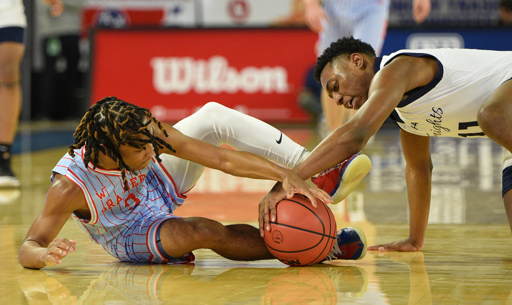 Staff Photo by Matt Hamilton / Power Center Academy (11) Marcus Prewitt wrestles Brainerd (3) Dennis Lewis Jr. for a loose ball on Tuesday, March 15, 2022 in Murfreesboro during the opening round of the class 2A boys state basketball tournament at Murphy Center on the campus of Middle Tennessee State University.