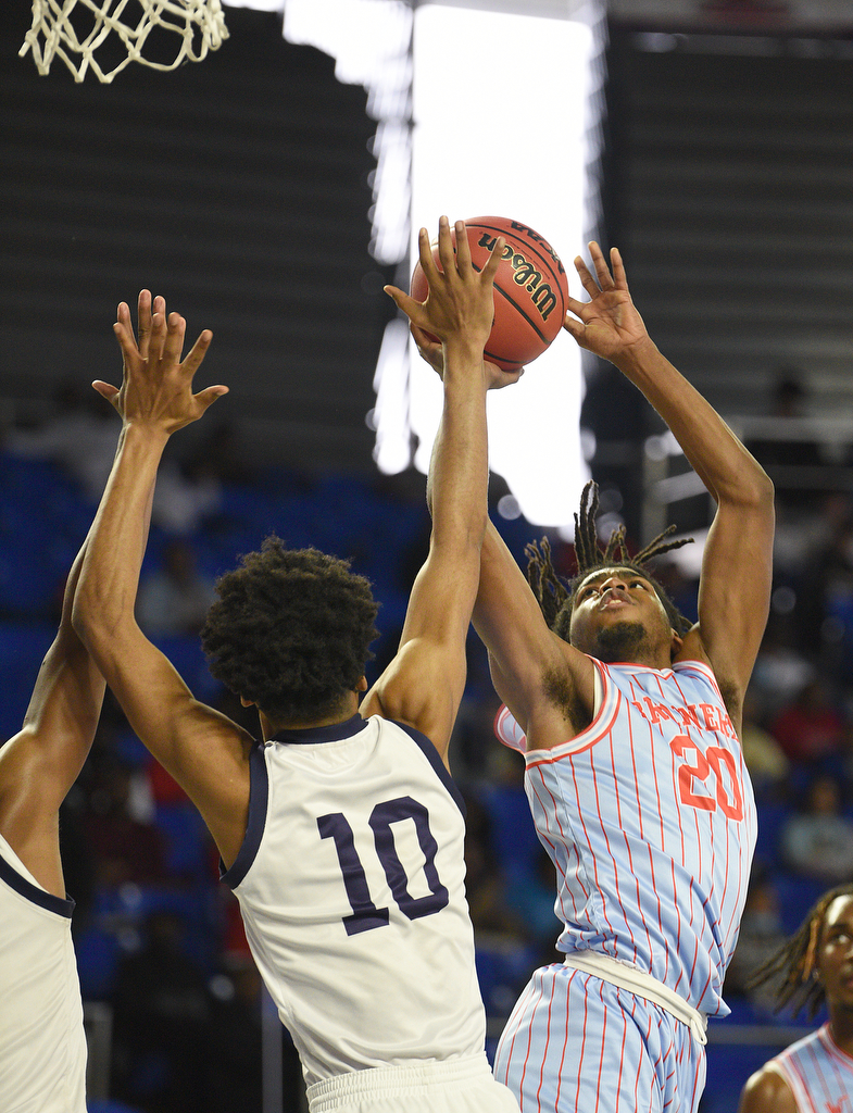 Staff Photo by Matt Hamilton / Power Center Academy (10) Jordan Brooks defends as Brainerd (20) Quintus Broadnax puts up a shot on Tuesday, March 15, 2022 in Murfreesboro during the opening round of the class 2A boys state basketball tournament at Murphy Center on the campus of Middle Tennessee State University.