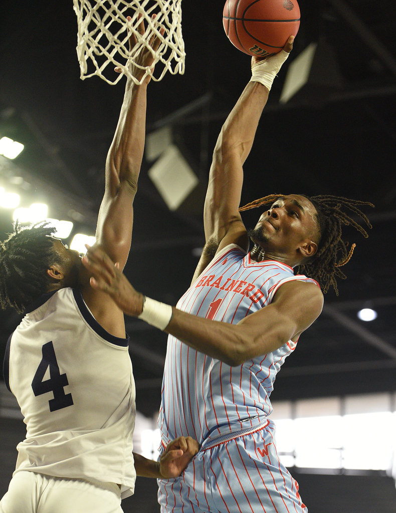 Staff Photo by Matt Hamilton / Power Center Academy (4) Earnest Hillman defends as Brainerd (1) Donivon Thomas slams a dunk on Tuesday, March 15, 2022 in Murfreesboro during the opening round of the class 2A boys state basketball tournament at Murphy Center on the campus of Middle Tennessee State University.