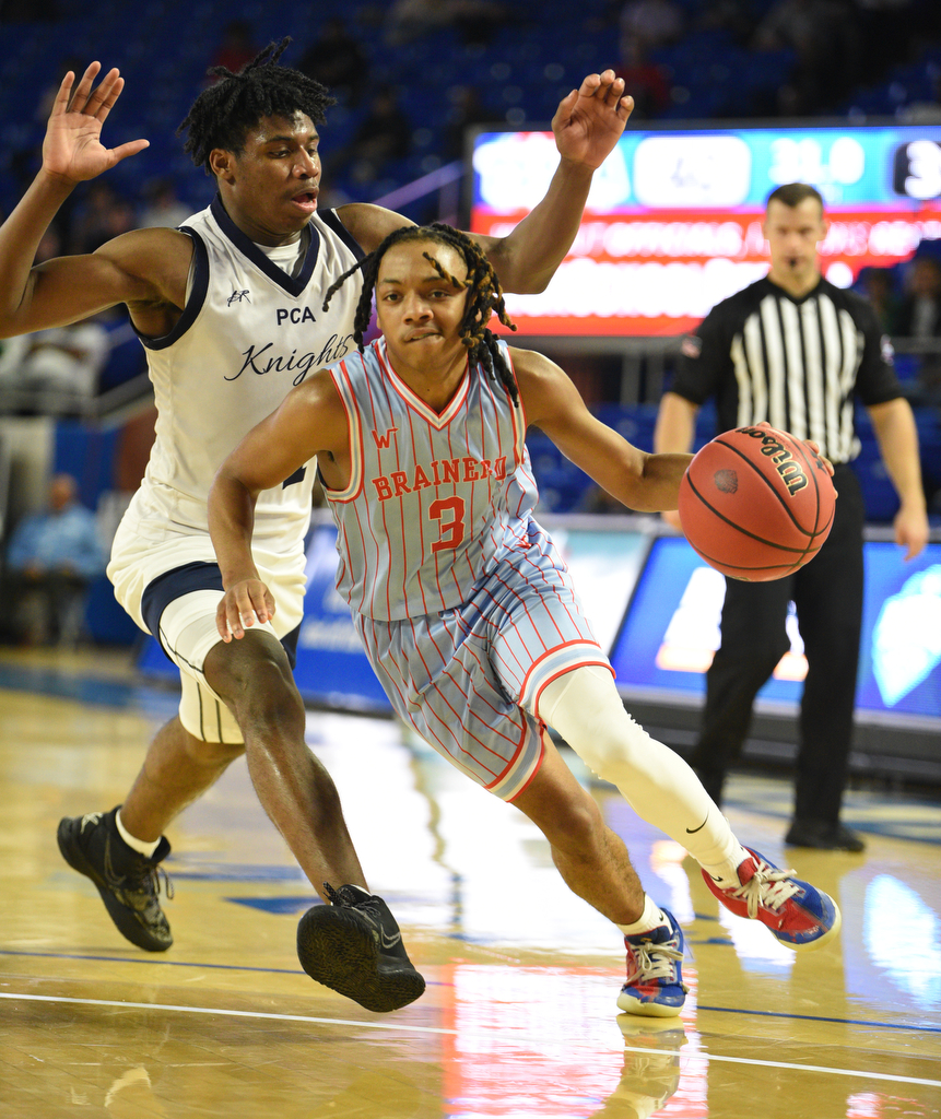 Staff Photo by Matt Hamilton / Power Center Academy (5) Cordarious Sledge defends as Brainerd (3) Dennis Lewis Jr. drives down the court during the opening round of the class 2A boys state basketball tournament at Murphy Center on the campus of Middle Tennessee State University.