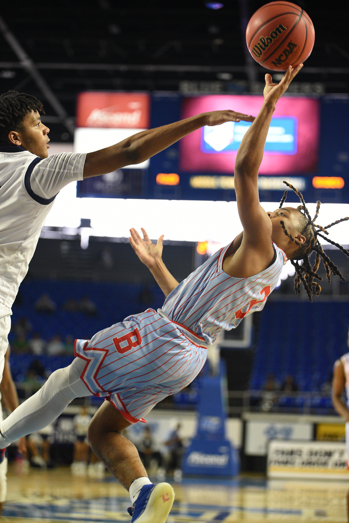 Staff Photo by Matt Hamilton / Power Center Academy (2) Caleb Jackson defends as Brainerd (3) Dennis Lewis Jr. puts up a shot on Tuesday, March 15, 2022 in Murfreesboro during the opening round of the class 2A boys state basketball tournament at Murphy Center on the campus of Middle Tennessee State University.
