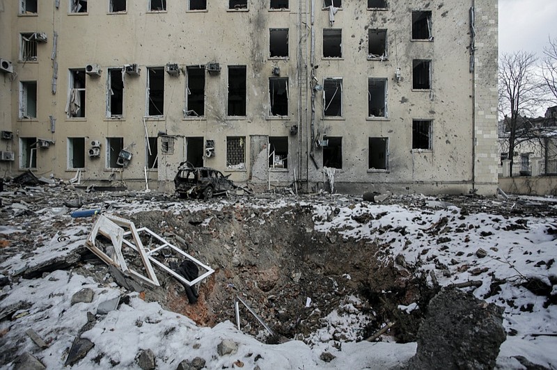 A view of a bomb crater after Russian shelling in the central of Kharkiv, Ukraine, Wednesday, March 16, 2022. (AP Photo/Pavel Dorogoy)


