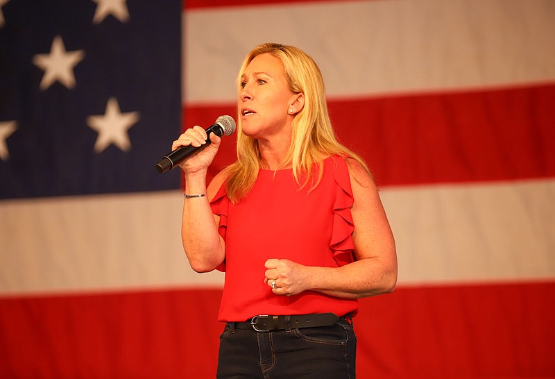 Staff photo by Olivia Ross / U.S. Rep. Marjorie Taylor Greene, R-Georgia, speaks to the crowd at the Coosa Valley Fairgrounds in Rome, Georgia, on March 5, 2022.