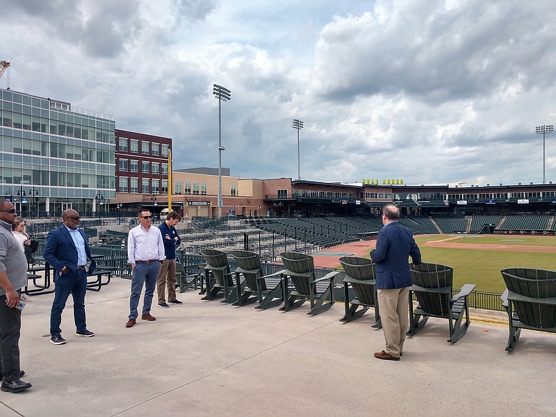 Staff photo by Mike Pare / Jason Freier, right, managing owner of the Chattanooga Lookouts, shows a group of Chattanoogans around Segra Park in Columbia, S.C., last week.