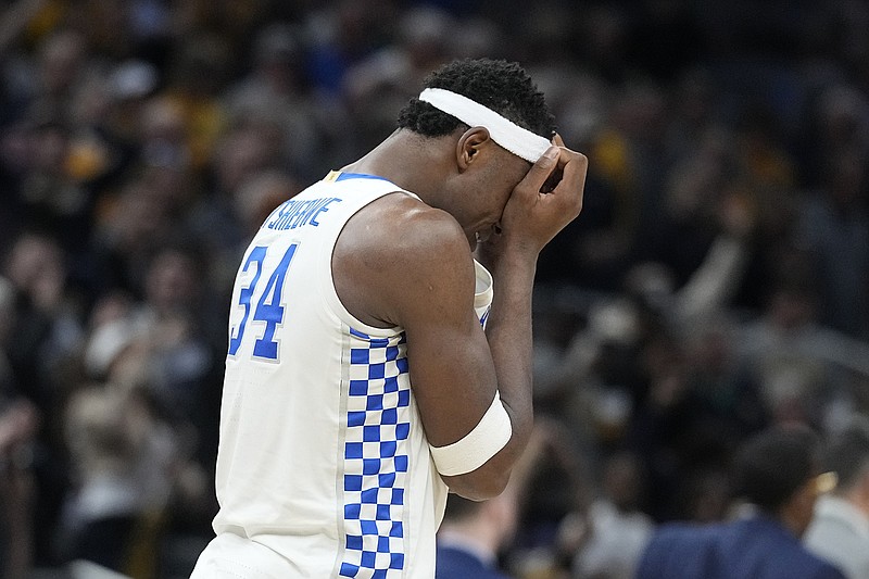AP photo by Darron Cummings / Kentucky's Oscar Tshiebwe covers his face at the end of the Wildcats' upset loss to Saint Peter's in the first round of the NCAA tournament Thursday night in Indianapolis.