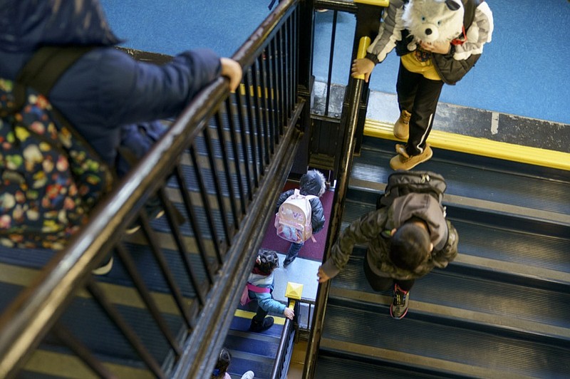 FILE - Students exit through a stairwell during dismissal at Raices Dual Language Academy, a public school in Central Falls, R.I., Feb. 9, 2022. (AP Photo/David Goldman, File)


