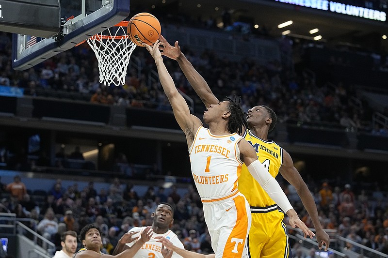 AP photo by Darron Cummings / Tennessee's Kennedy Chandler has his shot blocked by Michigan's Moussa Diabate during an NCAA tournament second-round game Saturday in Indianapolis.