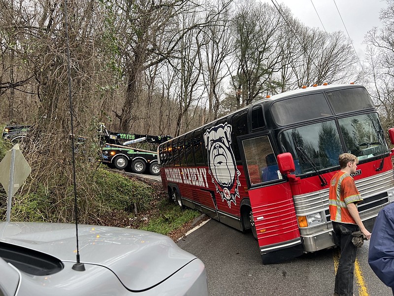 Contributed photo by Chrissy Joy / Maryland dog trainer Chrissy Joy stopped to entertain students delayed when their bus hit a ditch at the base of Lookout Mountain on March 7, 2022. Joy and three of her champion trick dogs were in Chattanooga to film a commercial.
