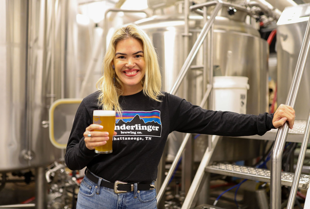 Staff photo by Olivia Ross / Molly Lamb stands near the beer deck at Wanderlinger Brewing Co. on March 19, 2022.