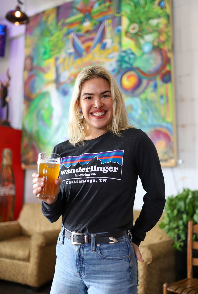 Staff photo by Olivia Ross / Molly Lamb stands near the front entrance at Wanderlinger Brewing Co. on Saturday, March 19, 2022. Lamb is the events coordinator and is spearheading the beer education classes at Wanderlinger.