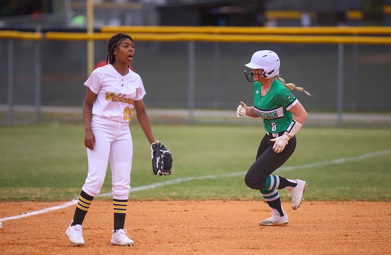 Staff photo by Olivia Ross  / East Hamilton High's Henley Apps runs to 3rd as Chelsea Paris of Hixson calls out to a team member on March 22, 2022. Hixson High School took on East Hamilton at home. 