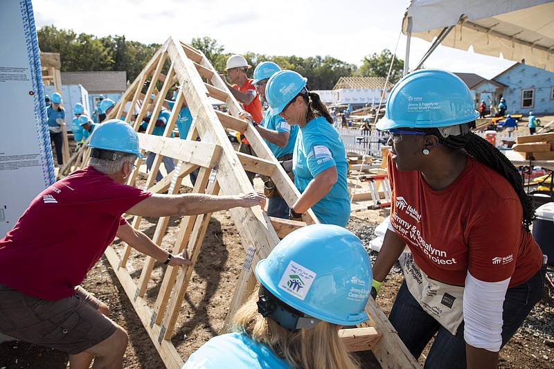 This photo provided by Habitat for Humanity International shows volunteers for Habitat for Humanity International, work on a house at the Carter Work Project in Nashville in 2019. MacKenzie Scott donated $436 million to Habitat for Humanity International and 84 of its U.S. affiliates — the largest publicly disclosed donation from the billionaire philanthropist since she pledged to give away the majority of her wealth in 2019. (Jason Asteros/Habitat for Humanity International via AP)