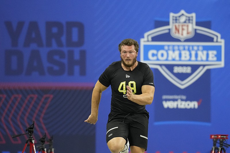AP photo by Charlie Neibergall / Former UTC offensive lineman Cole Strange runs the 40-yard dash at the NFL combine on March 4 in Indianapolis. ESPN draft analyst Mel Kiper said Wednesday he expects Strange to be selected in the third or fourth round of the NFL draft next month. UTC has never had a player selected in the first or second round, and just one in the third round, receiver Terrell Owens in 1996.