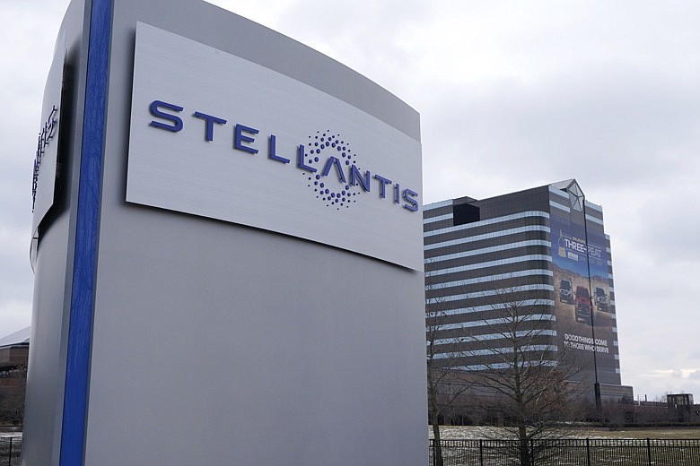 In this file photo taken on Jan. 19, 2021, the Stellantis sign is seen outside the Chrysler Technology Center, in Auburn Hills, Mich. A joint venture between Stellantis and South Korea's LG Energy Solution plans to build a large electric vehicle battery factory in Windsor, Ontario, employing about 2,500 people. It's expected to open early in 2024 and will be able to make battery cells and modules for over 500,000 electric vehicles per year. (AP Photo/Carlos Osorio, File)