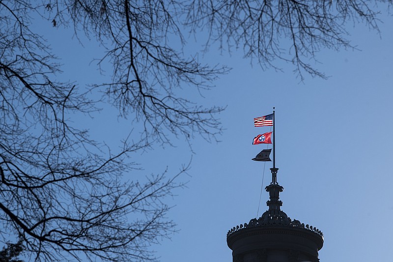 Photo John Amis of The Associated Press / Flags fly over the Tennessee state capitol on Feb.11, 2022, in Nashville, Tenn.