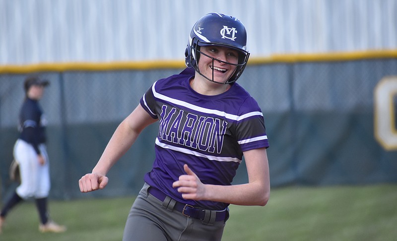 Staff photo by Patrick MacCoon / Marion County junior Emma Crisp is all smiles after hitting a three-run homer in Friday's 12-9 victory at Chattanooga Christian.