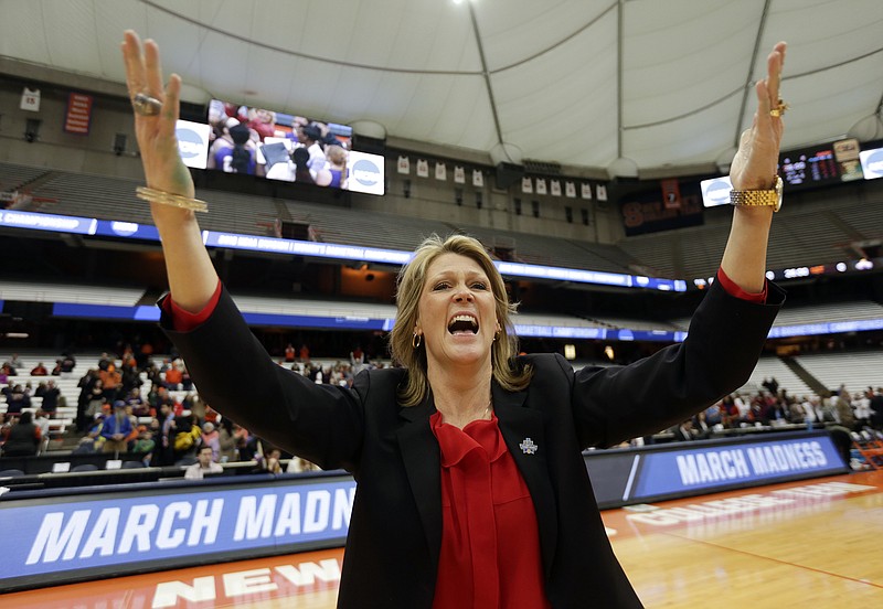 AP photo by Mike Groll / Katie Abrahamson-Henderson celebrates after coaching the Albany women's basketball team to a win over Florida in the first round of the 2016 NCAA tournament in Syracuse, N.Y. Abrahamson-Henderson left after that season for the University of Central Florida, which she led to a program-record 26 wins this past season. She was hired on Saturday by Georgia, where she played in the 1980s.