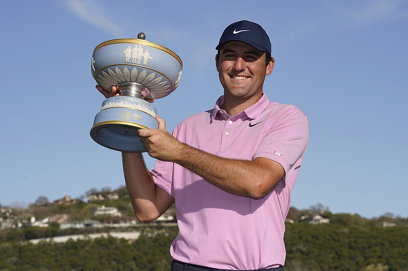 AP photo by Tony Gutierrez / Scottie Scheffler holds his trophy after beat Kevin Kisner in the championship final to win the Dell Technologies Match Play on Sunday in Austin, Texas.