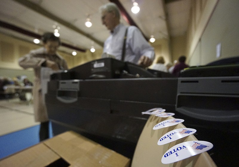 Staff file photo / A voter enters her ballot before getting a sticker at Concord Baptist Church in East Brainerd in 2016.