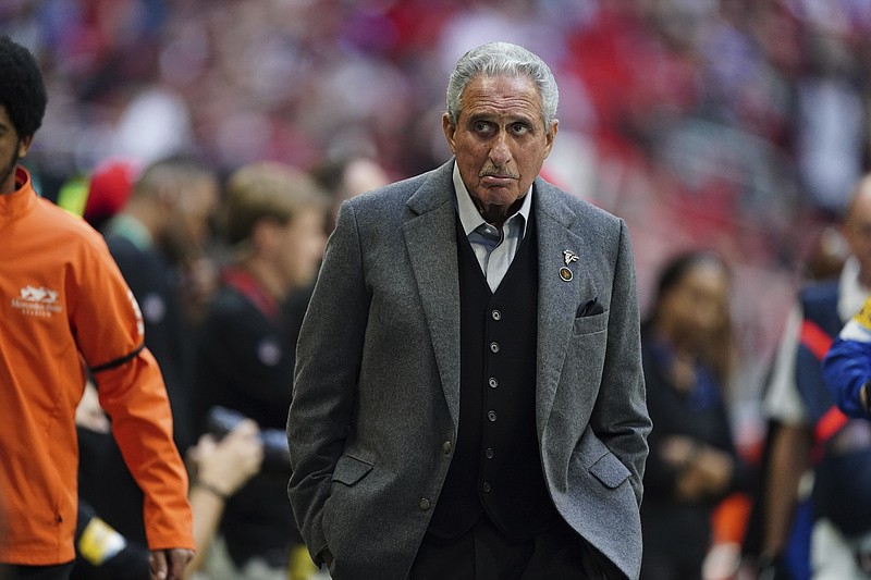 AP photo by John Bazemore / Atlanta Falcons owner Arthur Blank leaves the field after a home game against the Detroit Lions on Dec. 26.