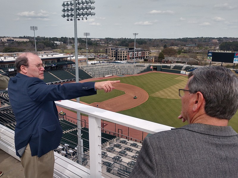 Staff file photo by Mike Pare / Jason Freier, left, the Chattanooga Lookouts' managing owner, shows City Council Chairman Chip Henderson the new and proposed development around Segra Park in Columbia, S.C., as Henderson and others from Hamilton County visited the ballpark on March 18 to see what could be done in Chattanooga's South Broad District.