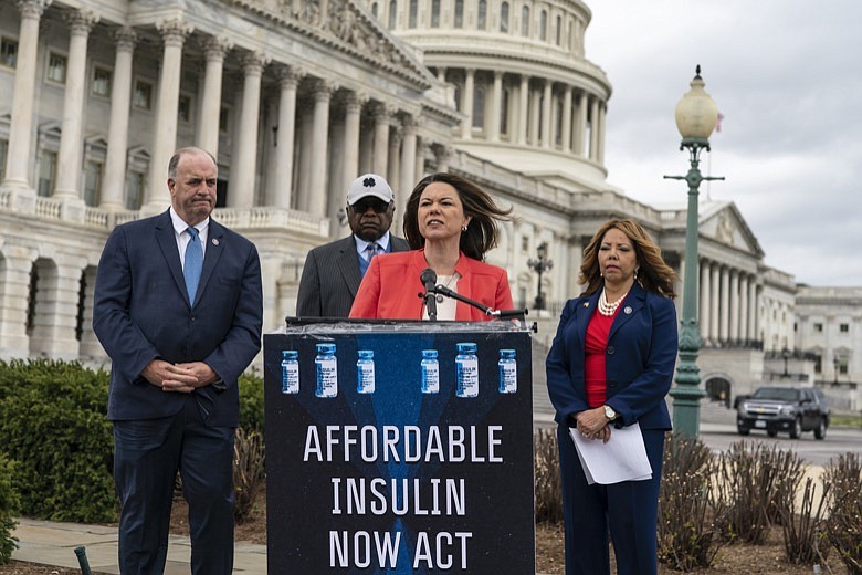 From left, Rep. Dan Kildee, D-Mich., House Majority Whip James Clyburn, D-S.C., Rep. Angie Craig, D-Minn., and Rep. Lucy McBath, Ga., talk about their support for legislation aimed at capping the price of insulin, at the Capitol in Washington, Thursday, March 31, 2022. The bill aims to keep consumers' out-of-pocket costs at no more than $35 per month. (AP Photo/J. Scott Applewhite)