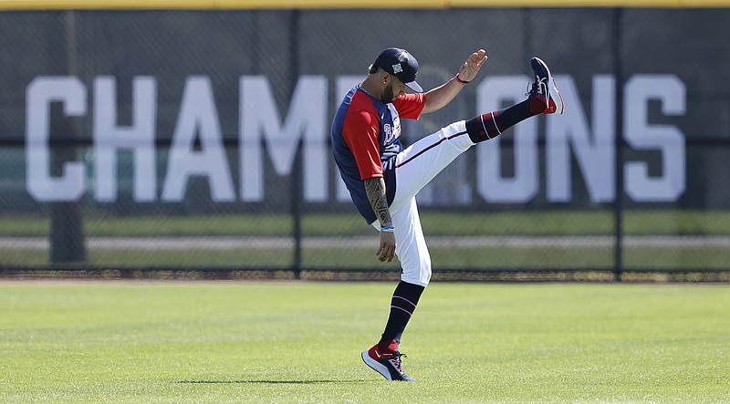 Atlanta Journal-Constitution photo by Curtis Compton via AP / Atlanta Braves outfielder Eddie Rosario loosens up for a spring training workout on March 17 in North Port, Fla. Rosario, a midseason acquistion last year who was the NLCS MVP, signed a two-year contract to return to the Braves, the reigning World Series champions.