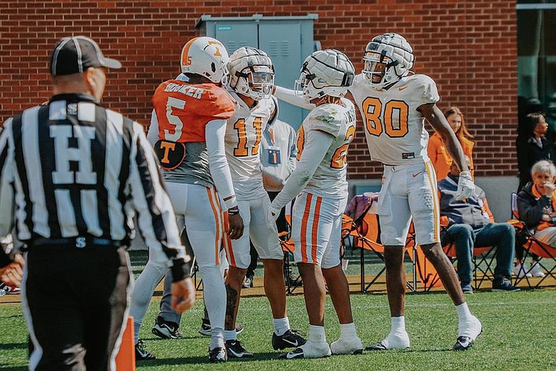 Tennessee Athletics photo / Tennessee quarterback Hendon Hooker (5), receiver Jalin Hyatt (11), running back Jaylen Wright (20) and receiver Ramel Keyton (80) celebrate a play during Saturday's first spring scrimmage in Knoxville.