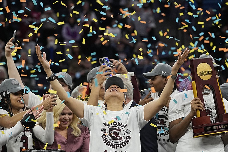 AP photo by Eric Gay / South Carolina women's basketball coach Dawn Staley celebrates after the Gamecocks beat Connecticut in the NCAA tournament title game Sunday night in Minneapolis.