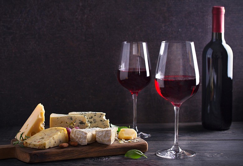 Wine and cheese. / Getty Images/iStock/freeskyline