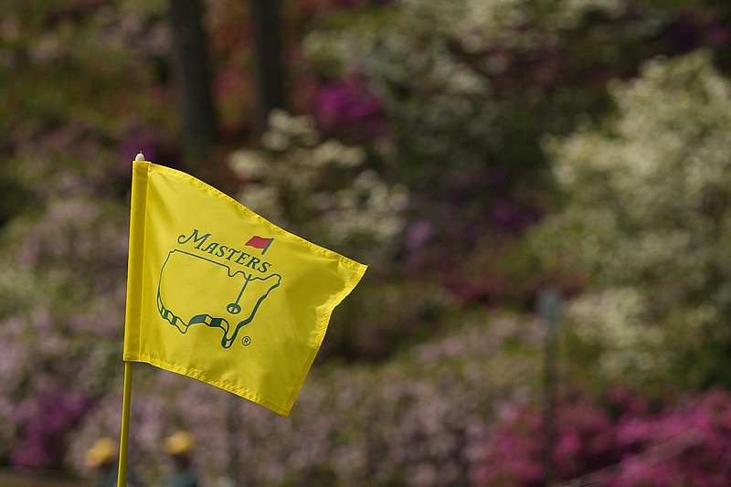 AP file photo by Charlie Riedel / The iconic Masters logo and the colors of the landscape are familiar sights at Augusta National Golf Club.