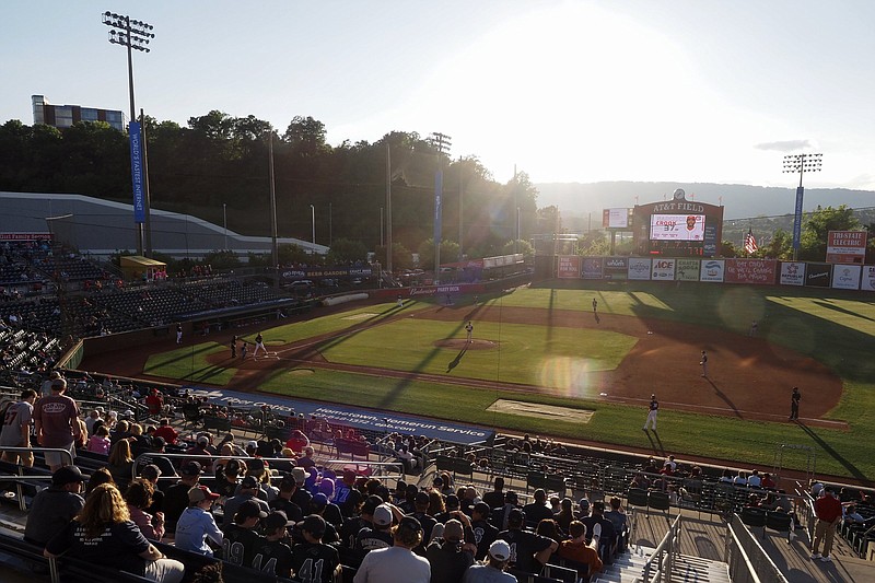 Staff file photo / Fans enjoy a game between the Chattanooga Lookouts and the Rocket City Trash Pandas at AT&T Field in May 2021. The Lookouts open their 2022 home season April 12 against the Birmingham Barons.