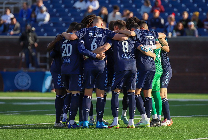 Staff photo by Olivia Ross  / Chattanooga FC players huddle before kickoff of Thursday night's U.S. Open Cup second-round match against Memphis 905 FC at Finley Stadium.