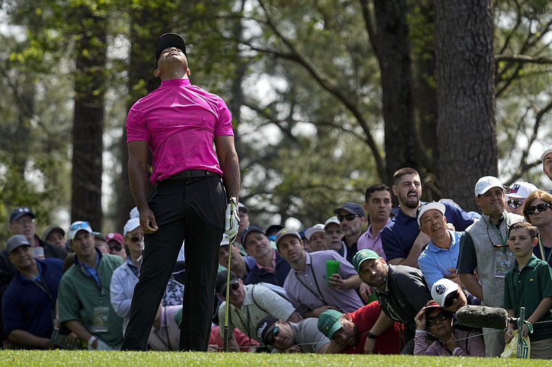 AP photo by Robert F. Bukaty / Tiger Woods reacts to his tee shot on the fourth hole at Augusta National during the first round at the Masters on Thursday.
