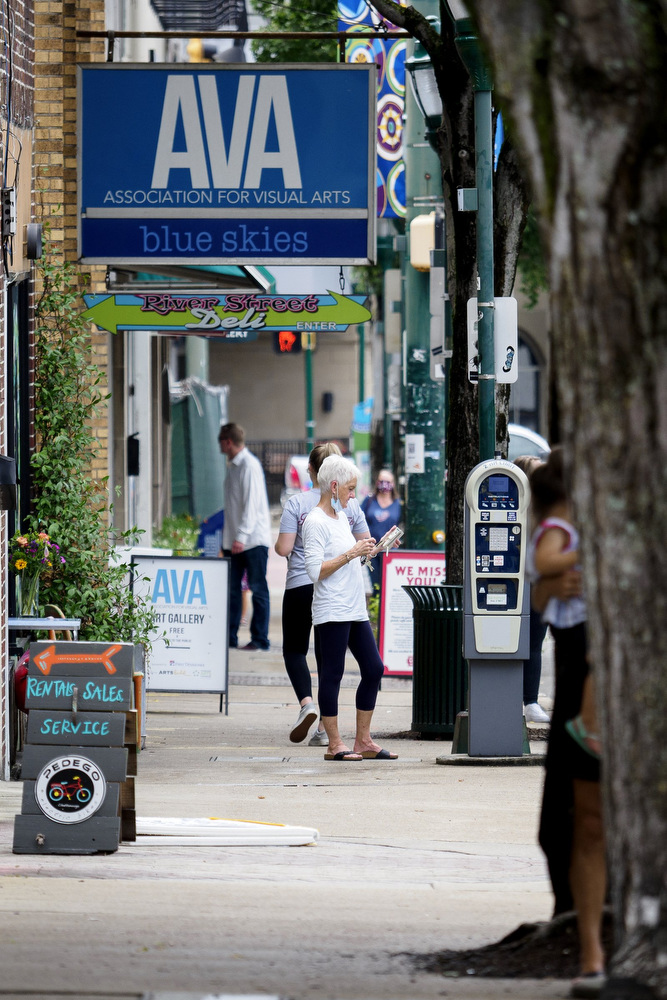 Staff photo by C.B. Schmelter / People walk along Frazier Avenue in front of the stores on Thursday, July 30, 2020 in Chattanooga, Tenn.