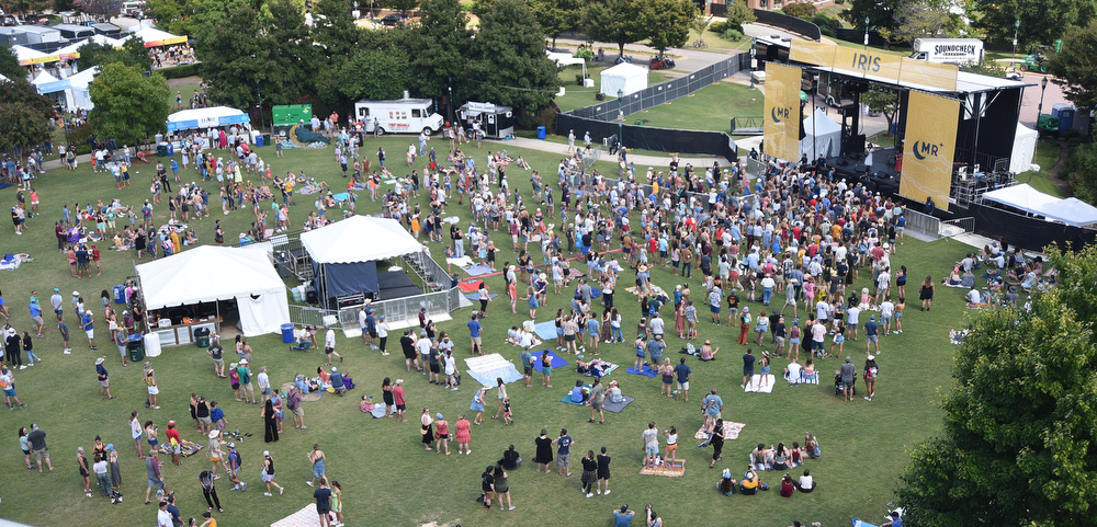 Staff Photo by Matt Hamilton / Festival-goers listen as the Overcoats perform on Saturday. Several bands performed on two stages in Coolidge Park for the Moon River Music Festival on Saturday, September 11, 2021.