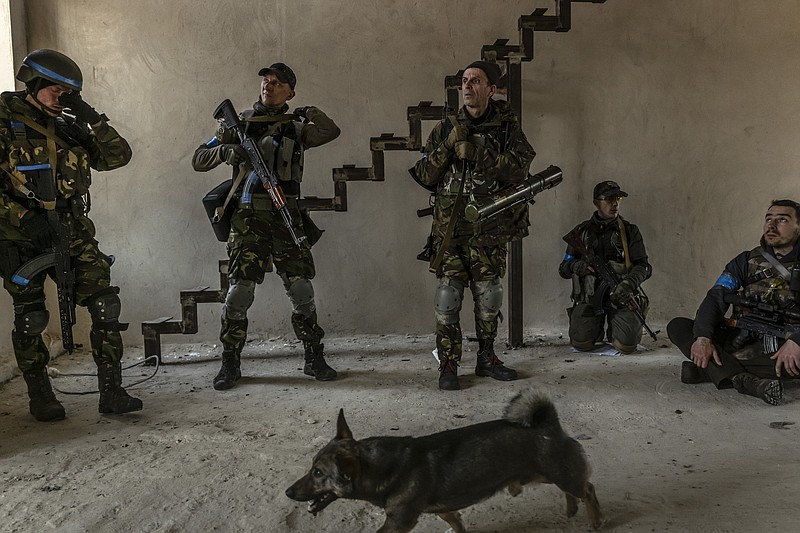 File photo by Daniel Berehulak of The New York Times / Ukrainian soldiers and foreign fighters are shown during a clearing out operation of Russian troops in Irpin, Ukraine, on March 29, 2022.