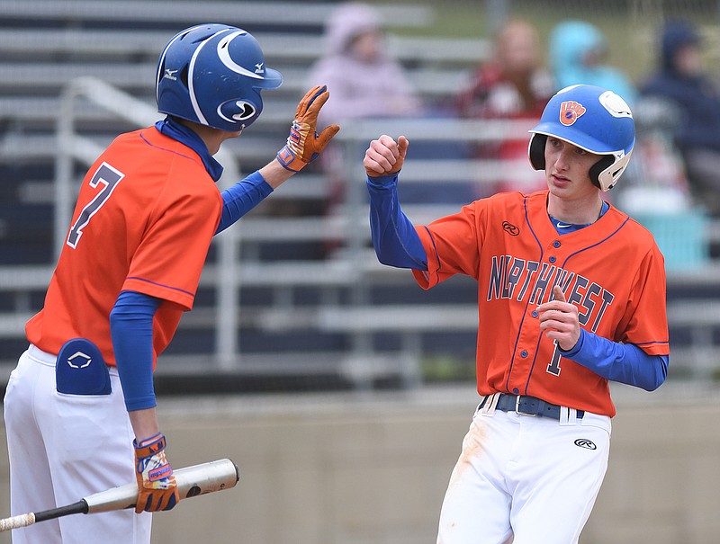 Staff photo by Matt Hamilton / Northwest Whitfield's Austin Cooley, left, celebrates with Seth Riverman after he scored during a GHSA Region 7-AAAA doubleheader Friday at Heritage.