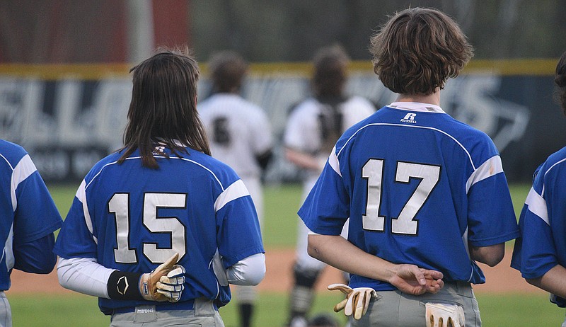 Staff Photo by Matt Hamilton / Red Bank baseball players Aiden Porter, left, and Jack Barkeloo stand for the National Anthem at Lookout Valley High School on Friday, March 25, 2022.