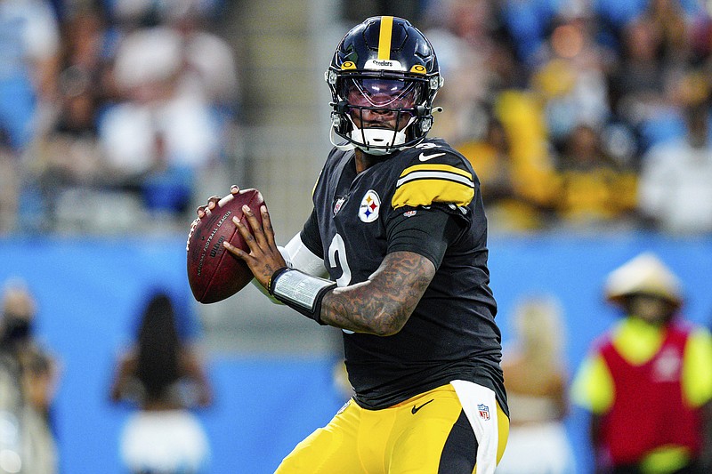 AP photo by Jacob Kupferman / Pittsburgh Steelers quarterback Dwayne Haskins plays in an NFL preseason game against the Carolina Panthers in August. Haskins, who set program records at Ohio State and was a first-round draft pick by Washington in 2019, was killed early Saturday morning when he was hit by a dump truck in Florida. Haskins was 24.